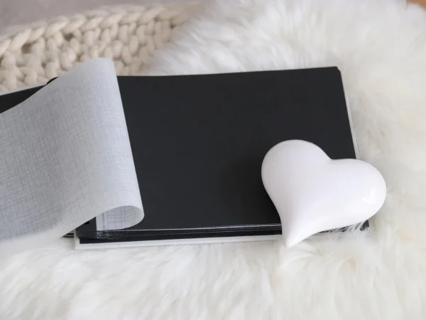 Luxury photo album with lay-flat pages on a wooden table